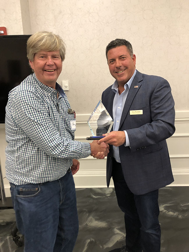 Doug Rieck receives the President's Award from CWONJ President Dino Nicoletta